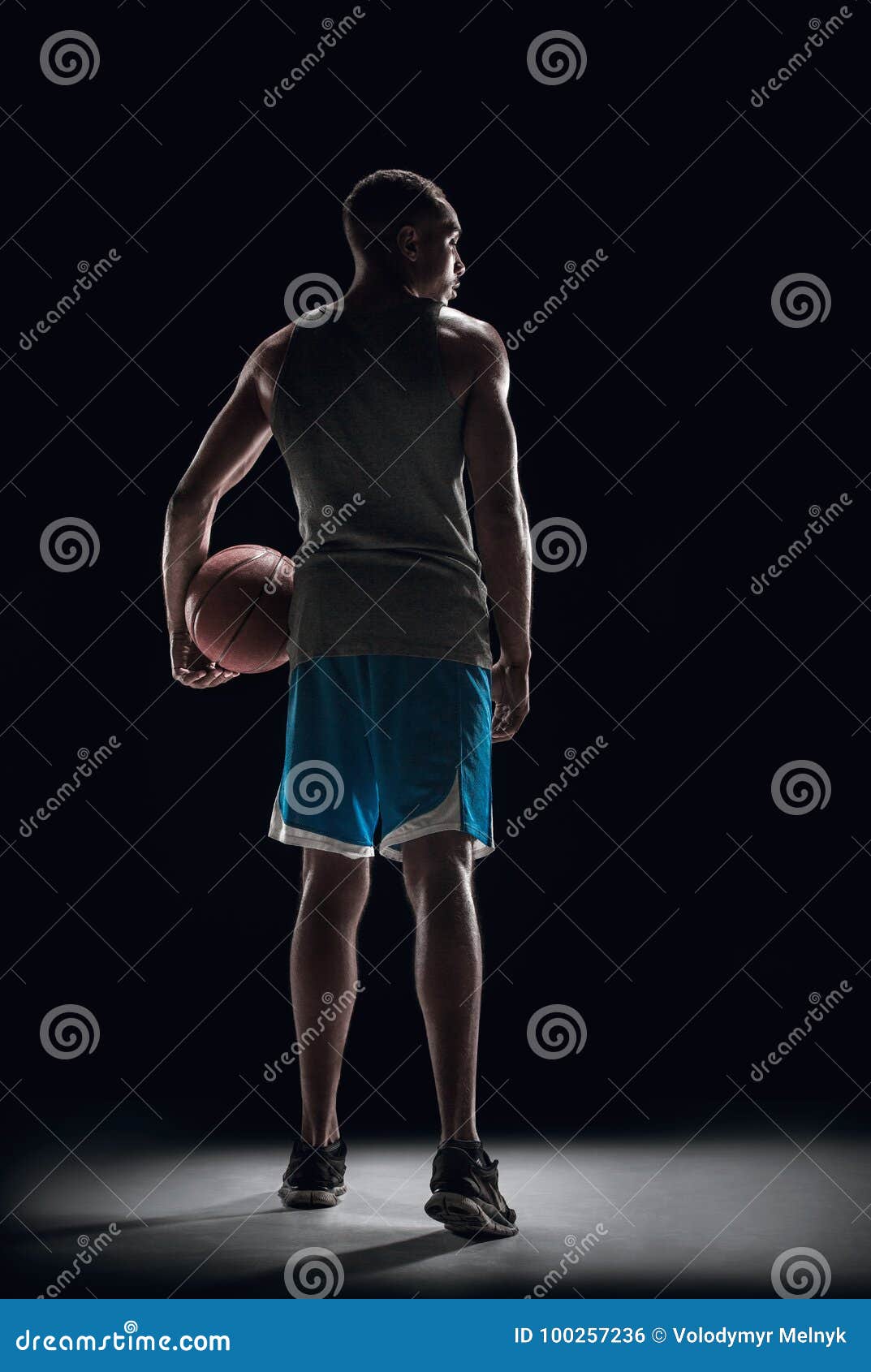 The Back of a Basketball Player with Ball Stock Photo - Image of