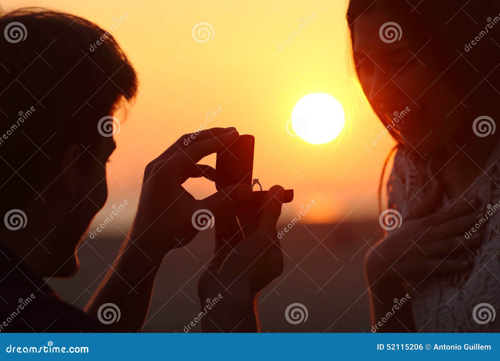 back light of a proposal of marriage at sunset