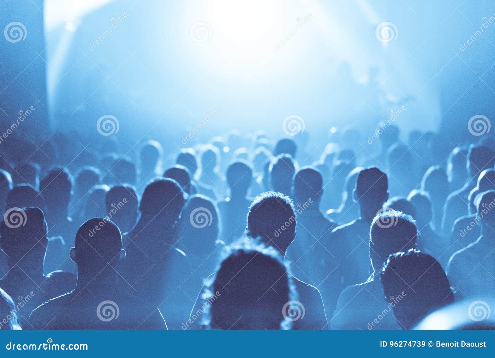 Blue Ambiance and Crowd in Silhouette during a Concert Stock Image