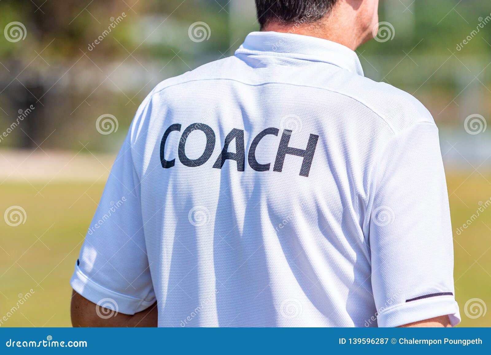 Back of Male Sport Coach Wearing COACH Shirt at an Outdoor Sport Field  Editorial Photography - Image of game, training: 139596287
