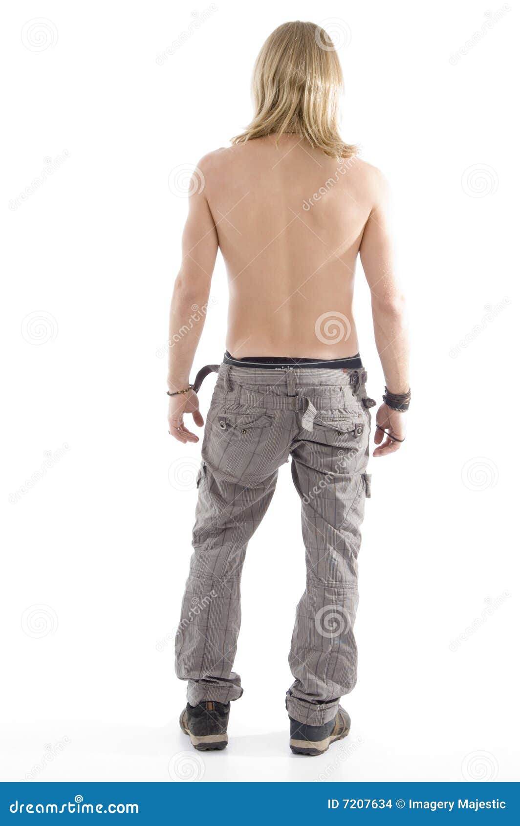 sexy man leaned back and posing on a light background in shorts, sweater  and socks 22254172 Stock Photo at Vecteezy