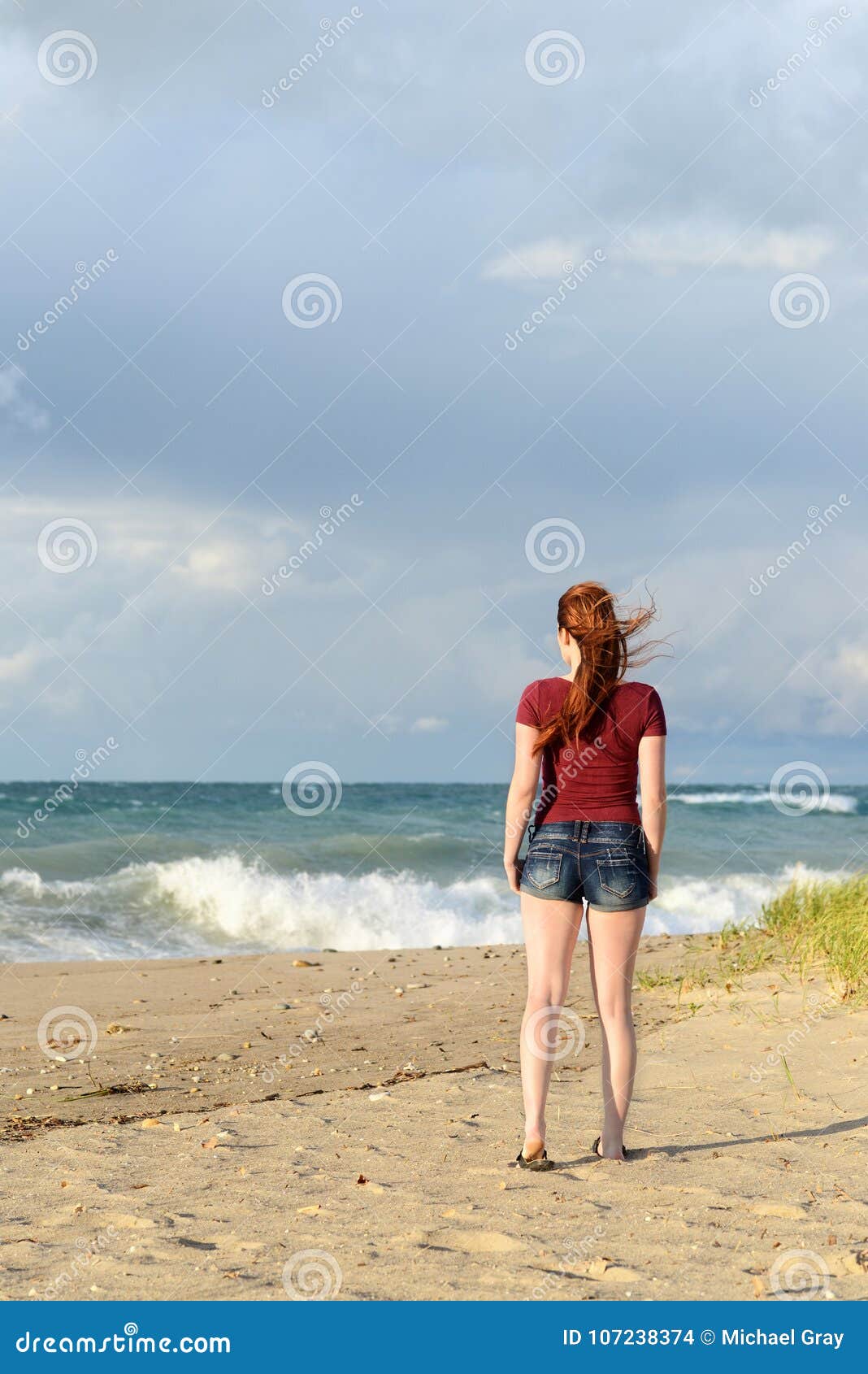 Back of Redhead Woman on Beach after a Storm Stock Photo - Image of nature,  romantic: 107238374