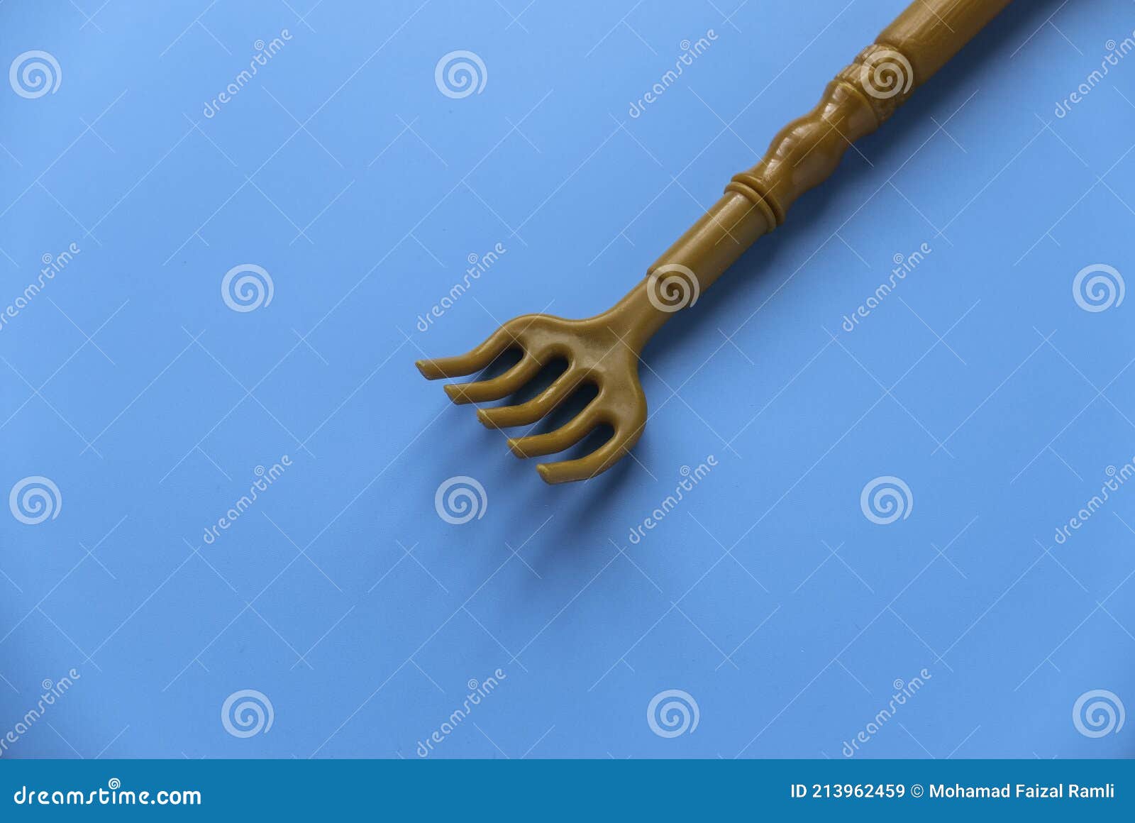 Back Scratcher on Blue Background Stock Image Image of tool, device