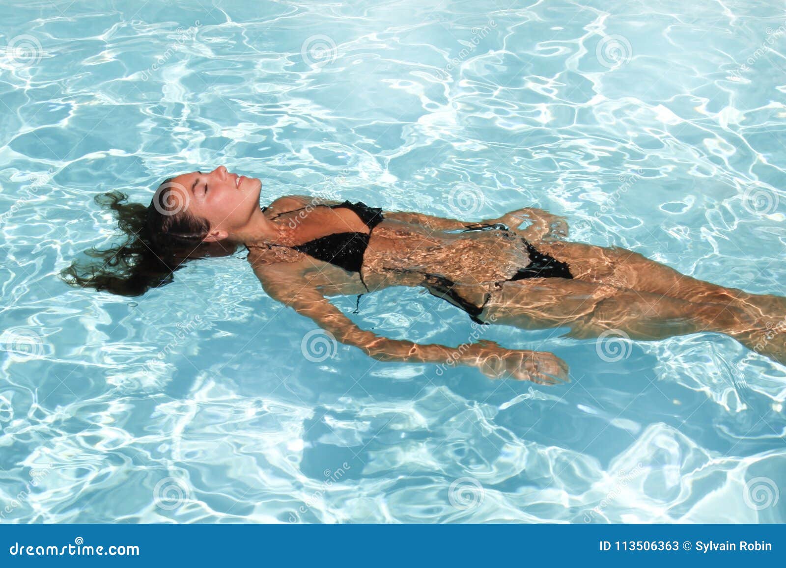 swimming girl in summer pool holydays