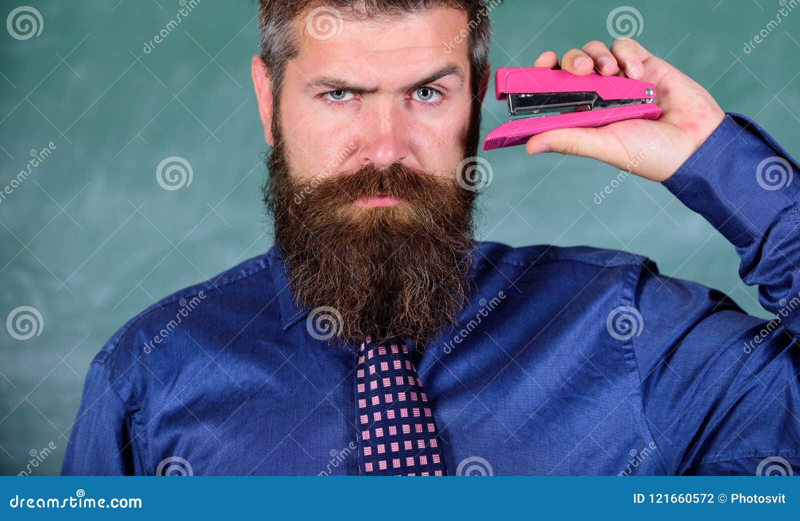 back to school and studying. teaching memorization techniques. teacher bearded man with pink stapler chalkboard