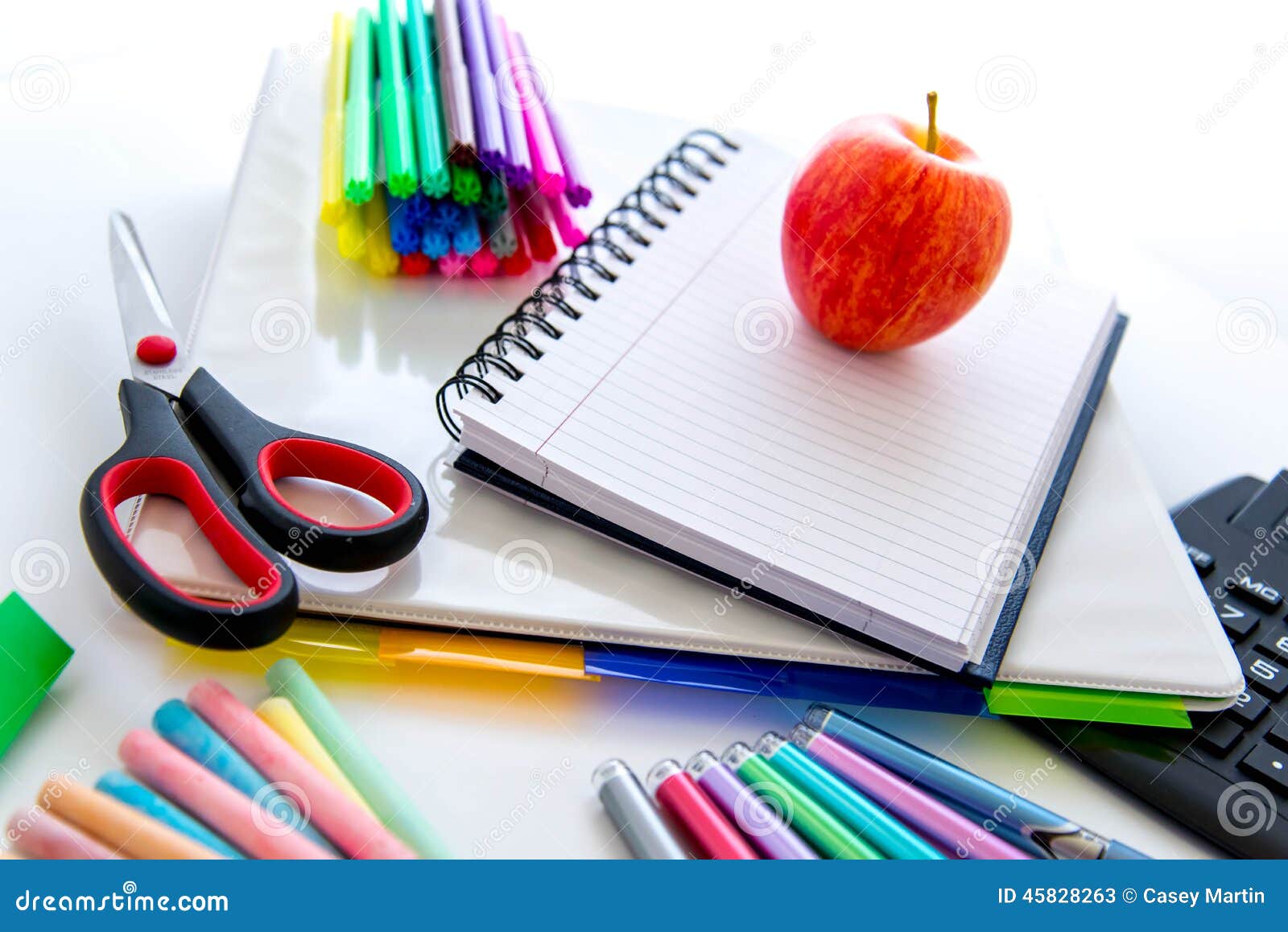 Back To School Supplies and an Apple for the Teacher Stock Image