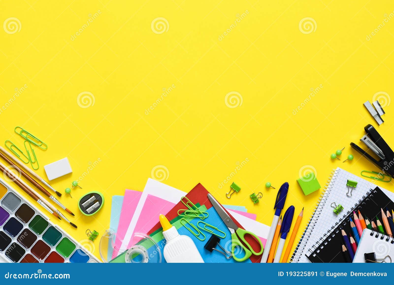 Back To School. School Supplies on a Yellow Background. Layout of
