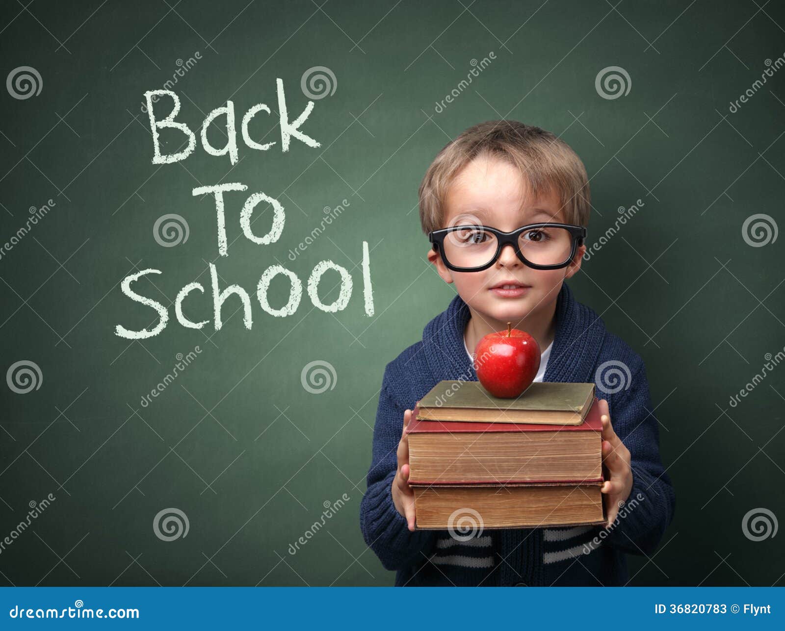 back to school young child holding stack books written chalk blackboard 36820783