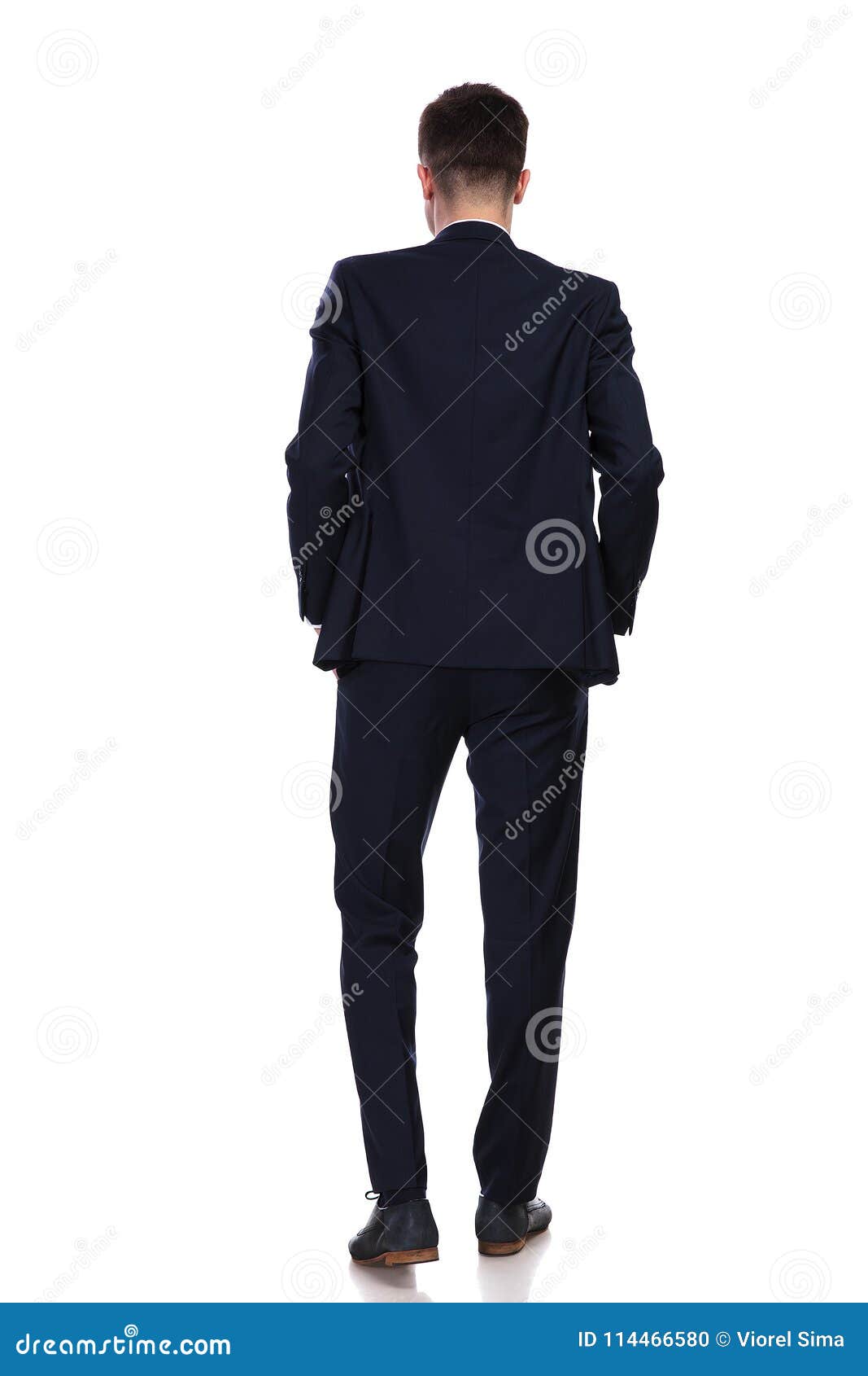 Back View of Businessman Standing with Hands in Pockets Stock Photo ...