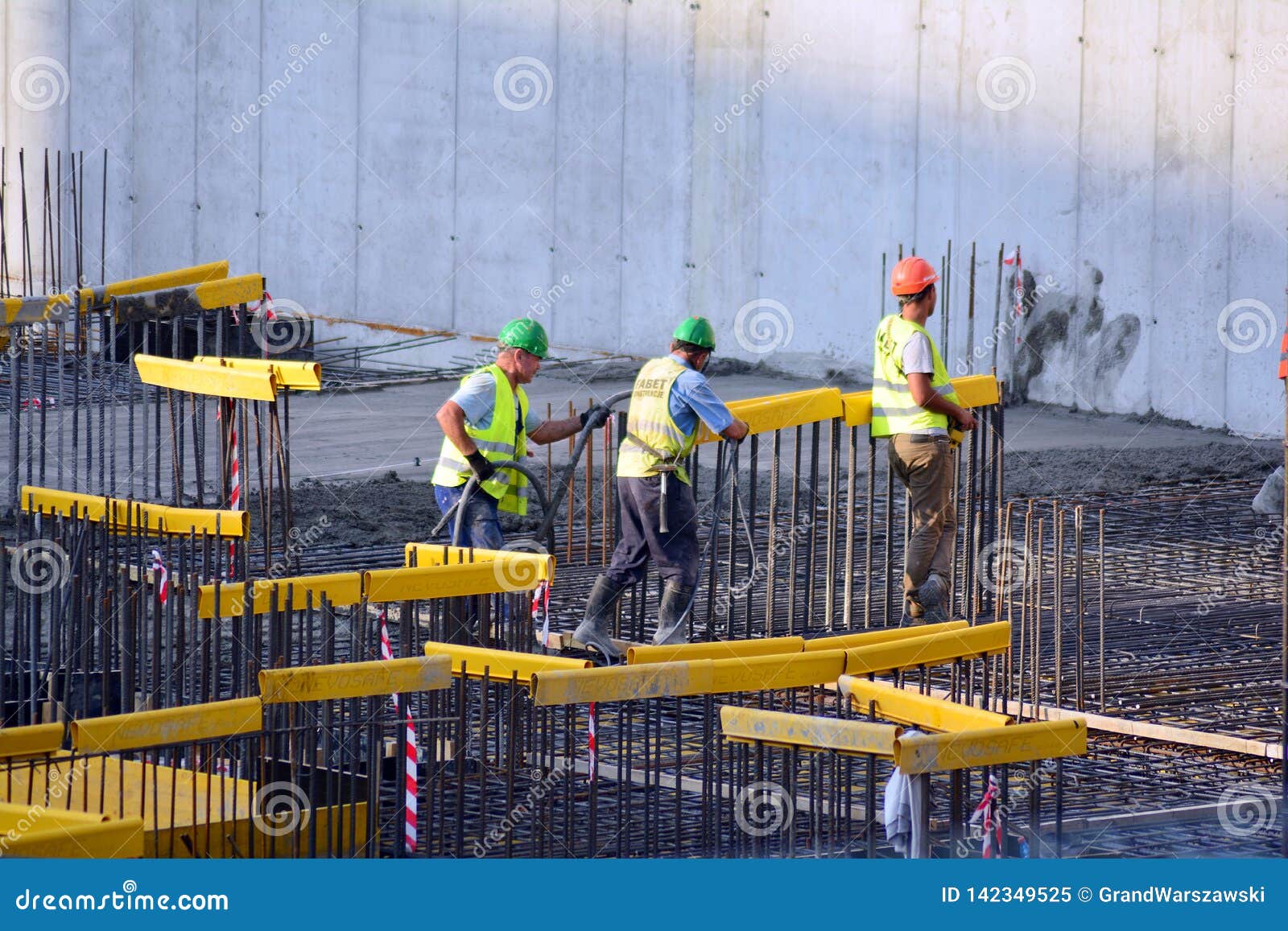 Back View of a Construction Worker Walking into a Building Site