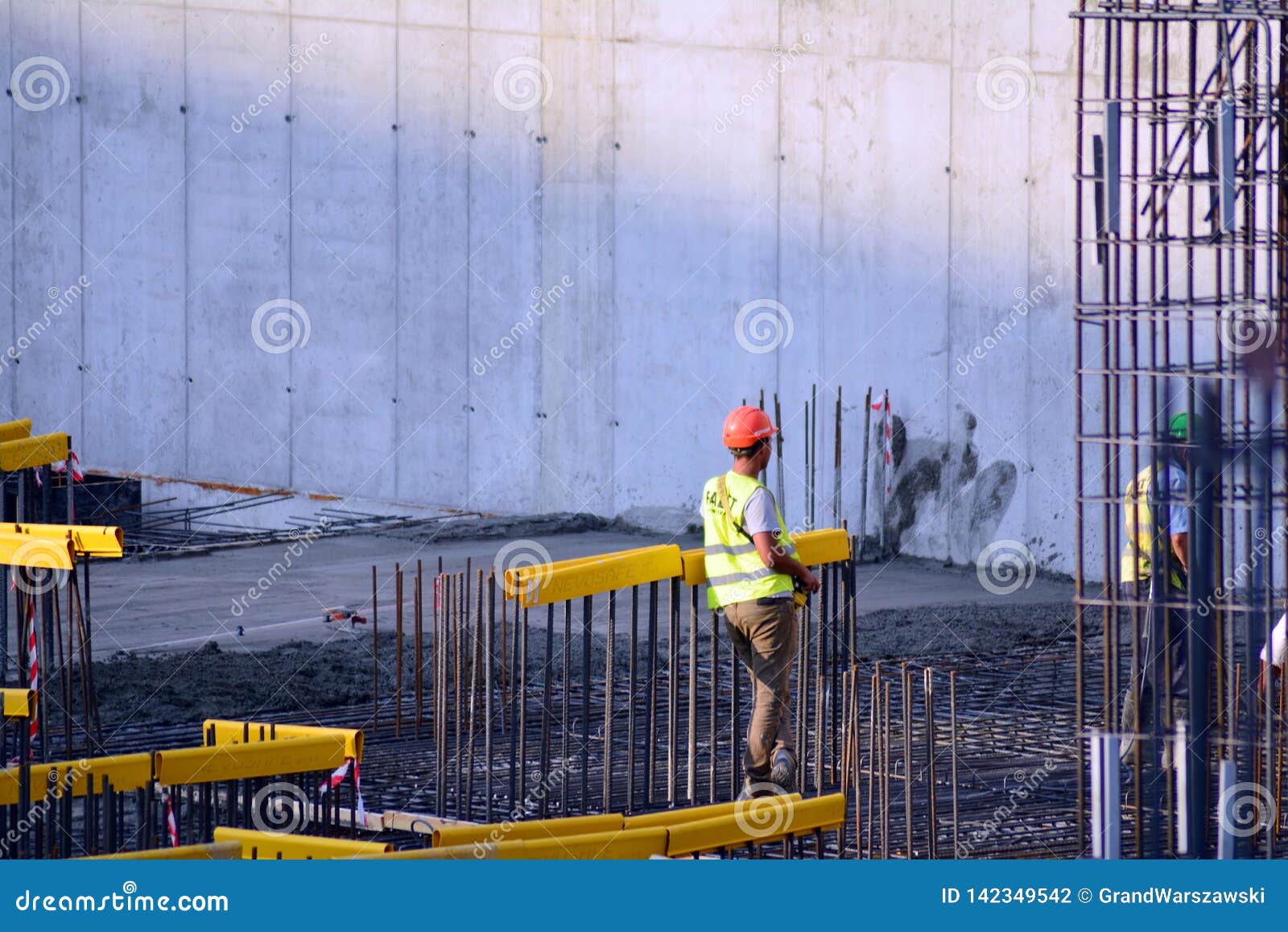 Back View of a Construction Worker Walking into a Building Sites