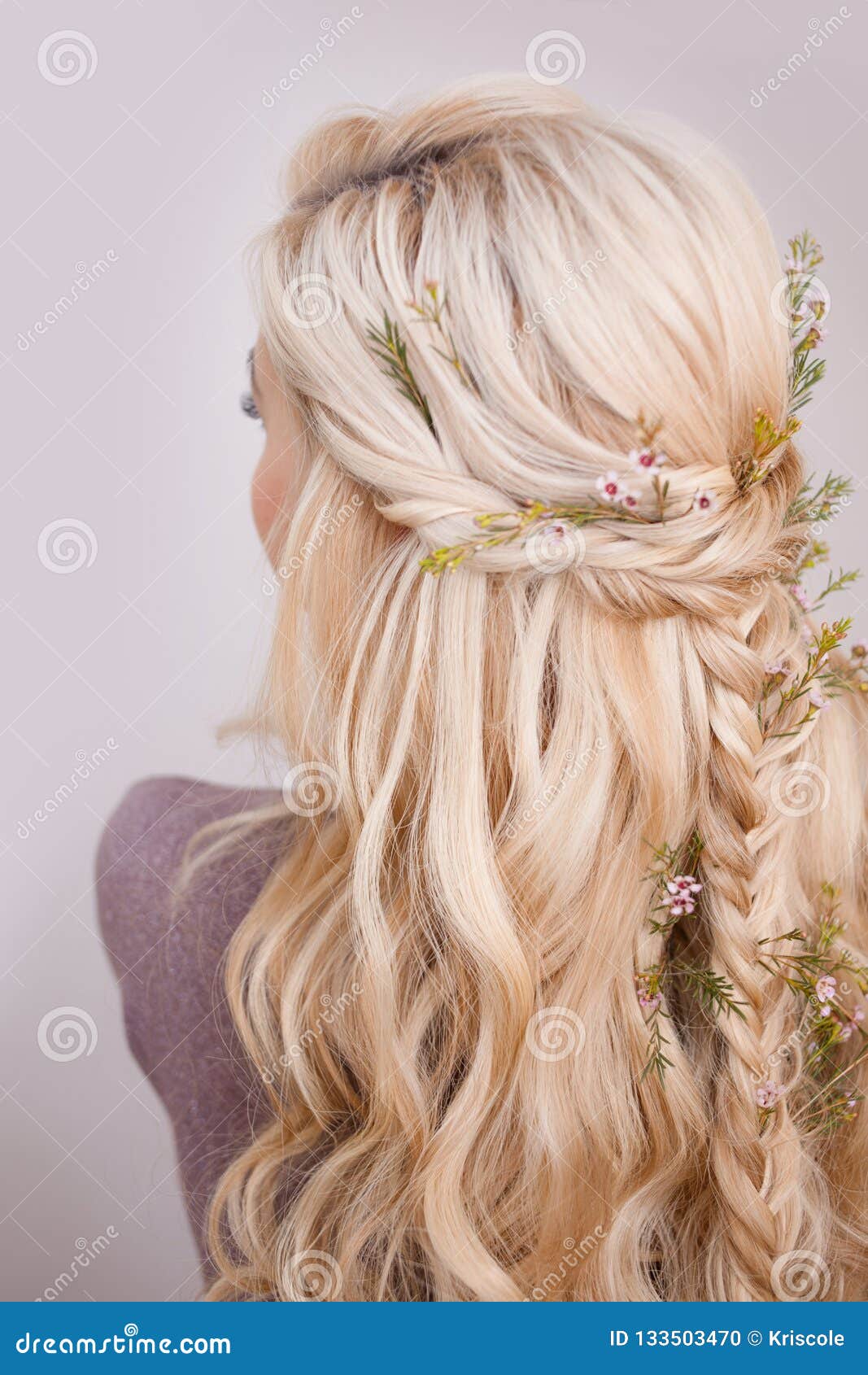 Back View Of An Elegant Trendy Hairstyle Interlacing Curls And