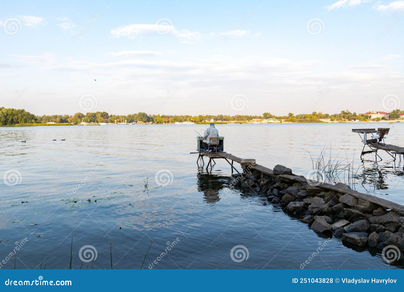 Back View of Fisherman with a Lot of Fishing Rods and a Net for Fish.  Fishing on the River Stock Photo - Image of person, nature: 251043828