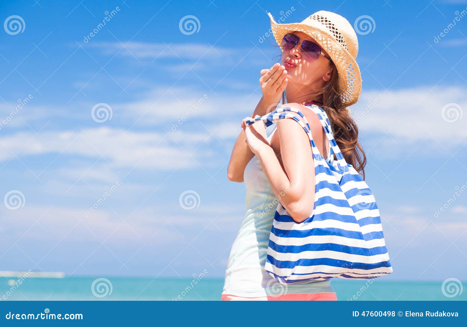 Back View of a Fit Young Woman with Stripy Bag at Stock Photo - Image ...