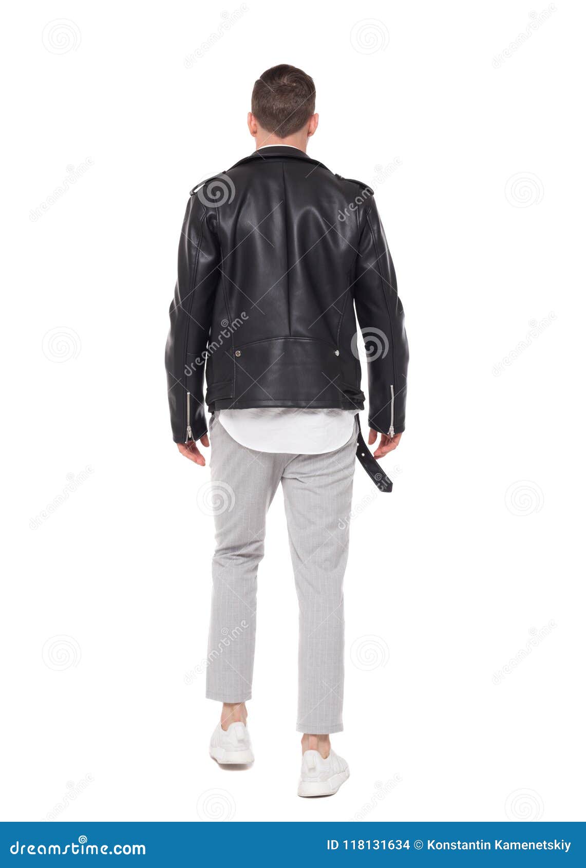 back view of going handsome man in a leather jacket and trouser