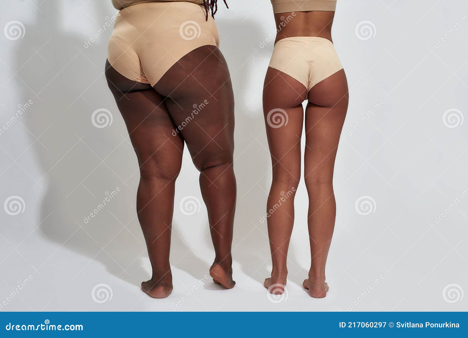 Back View of Legs of Two Women in Beige Underwear with Different