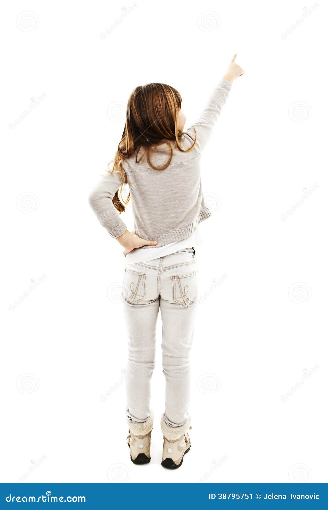 Back View Of Little Girl Points At Wall. Rear View Stock Photo Image