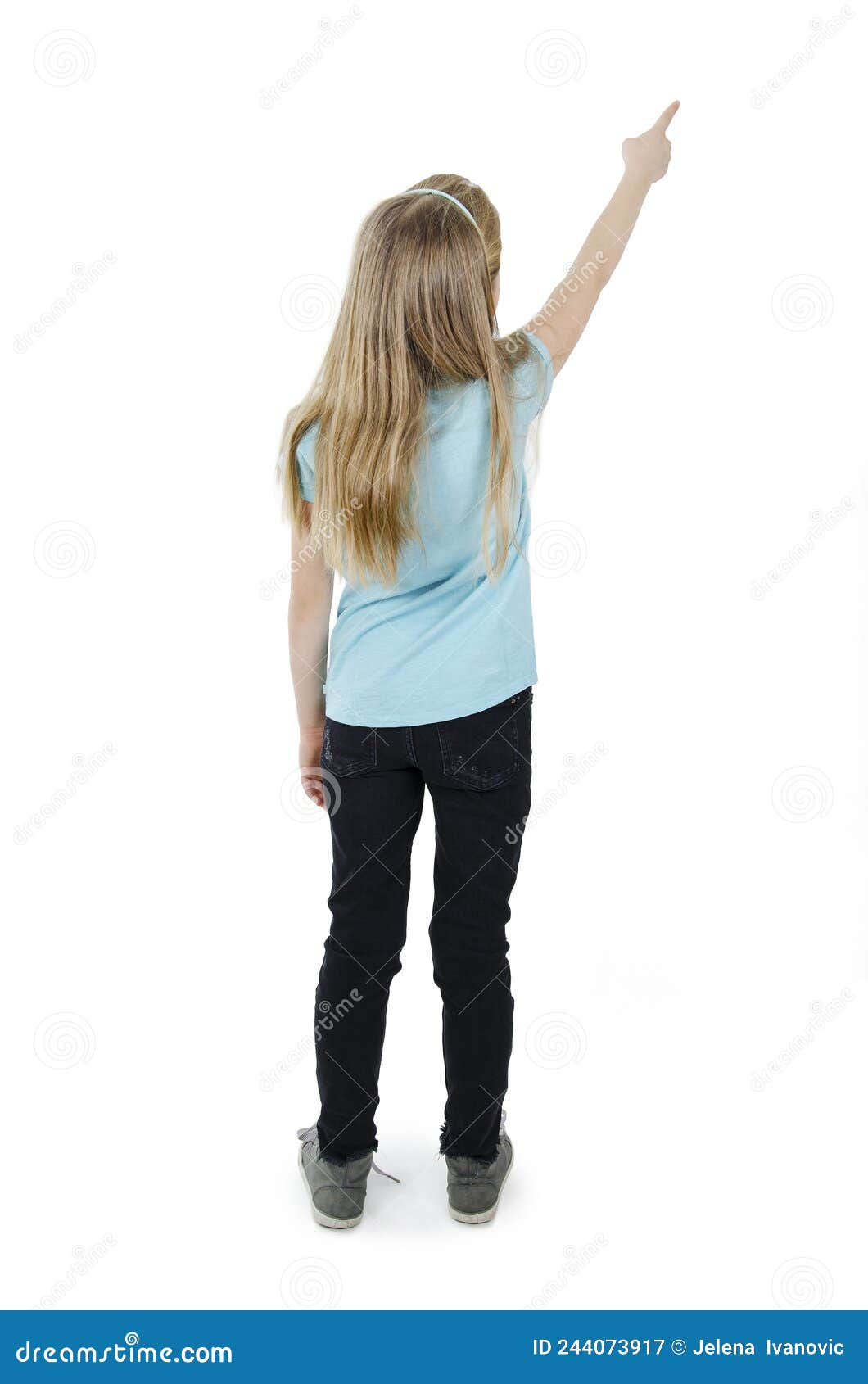 Back View of Little Girl Points at Wall. Rear View Stock Image - Image ...