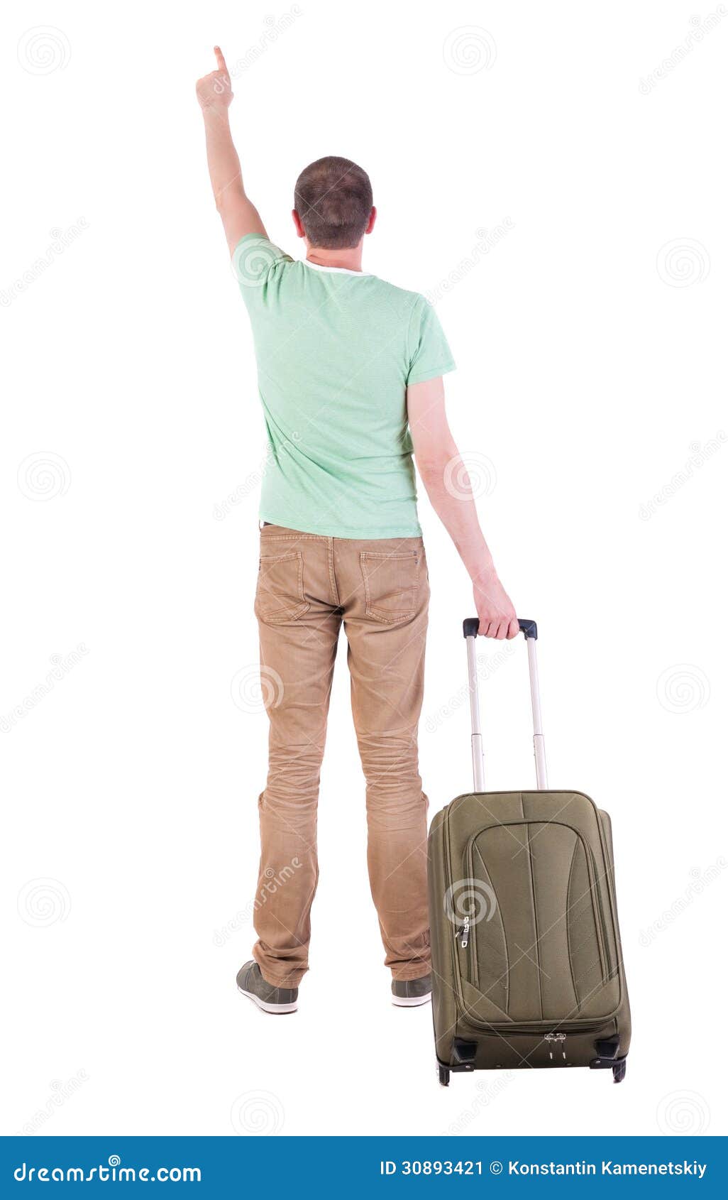 Back view of man with suitcase. brunette guy pointing in motion. backside view of person. Rear view people collection. Isolated over white background. guy with a travel bag on wheels looking at something at the top. Man wears green and white t-shirt and brown jeans