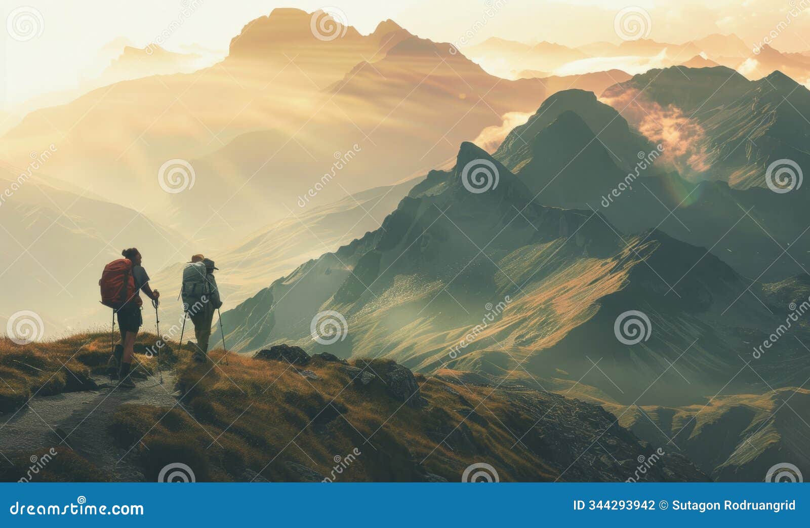 back view of mountain nomads people traversing mountain range