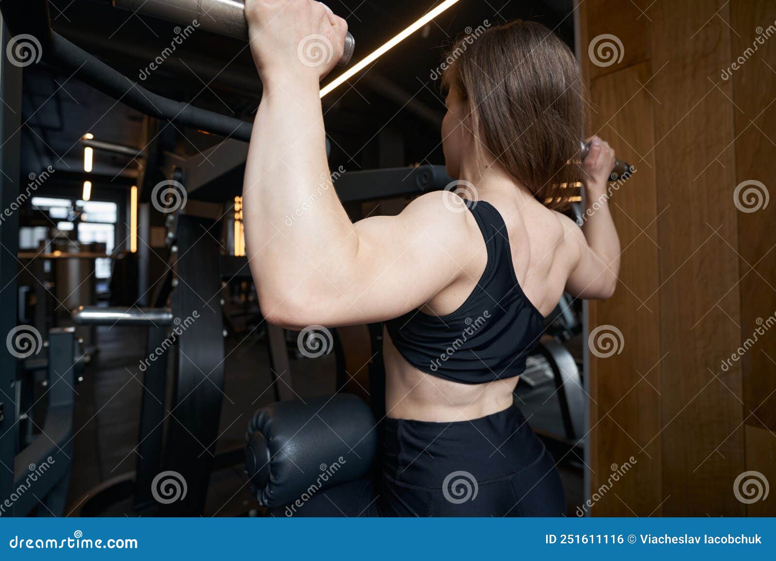 Female Athlete Performing Upper-body Workout on Fitness Equipment Stock  Photo - Image of athletic, fitness: 251611116