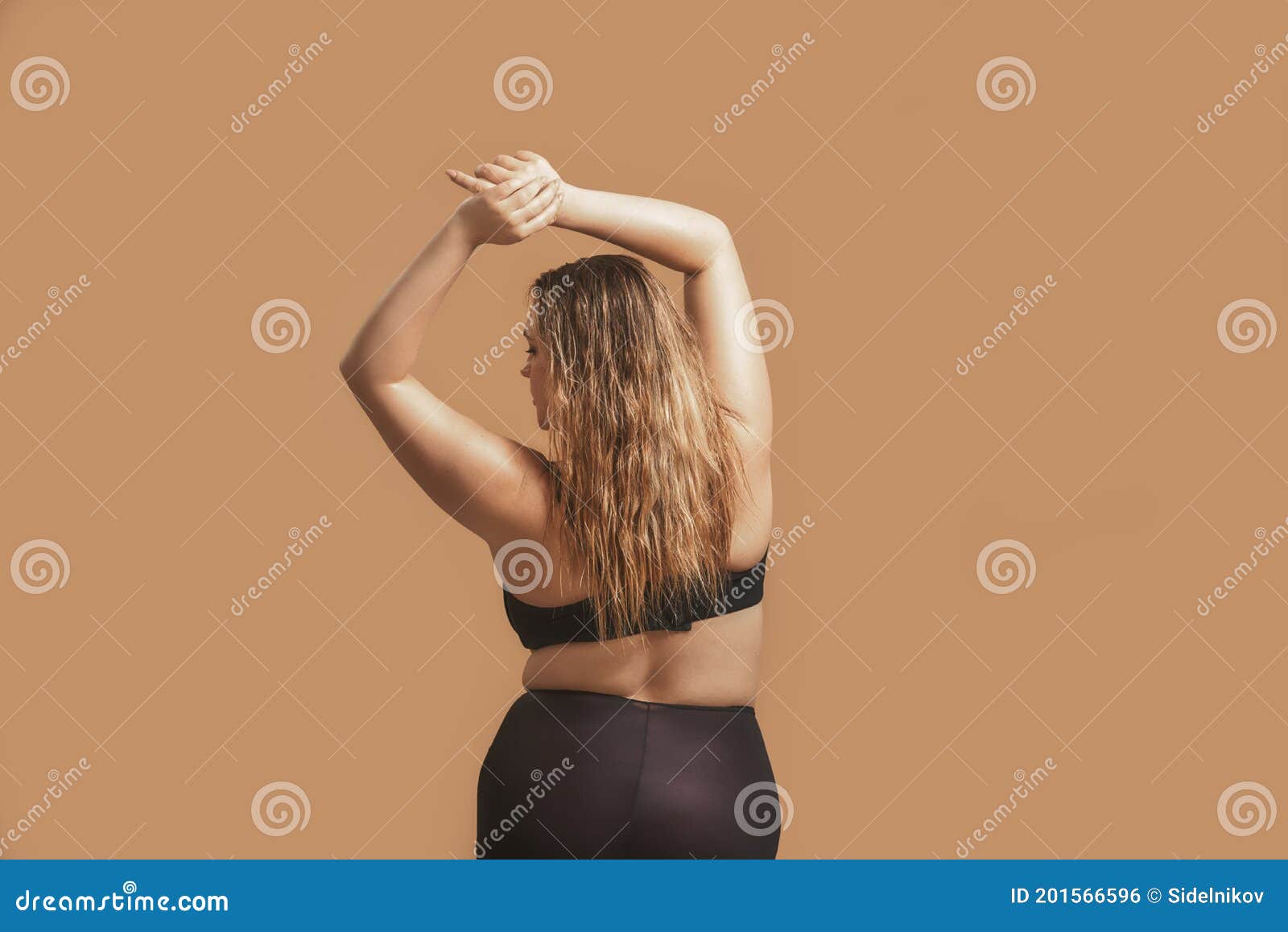 Sweaty woman with wavy brown hairs dressed in underwear Stock Photo by  fxquadro