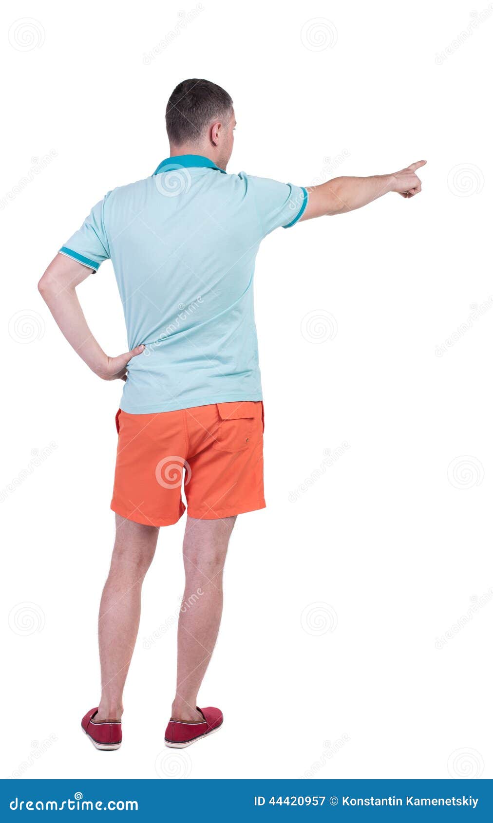 Back View Of Pointing Young Men In T-shirt And Shorts ...