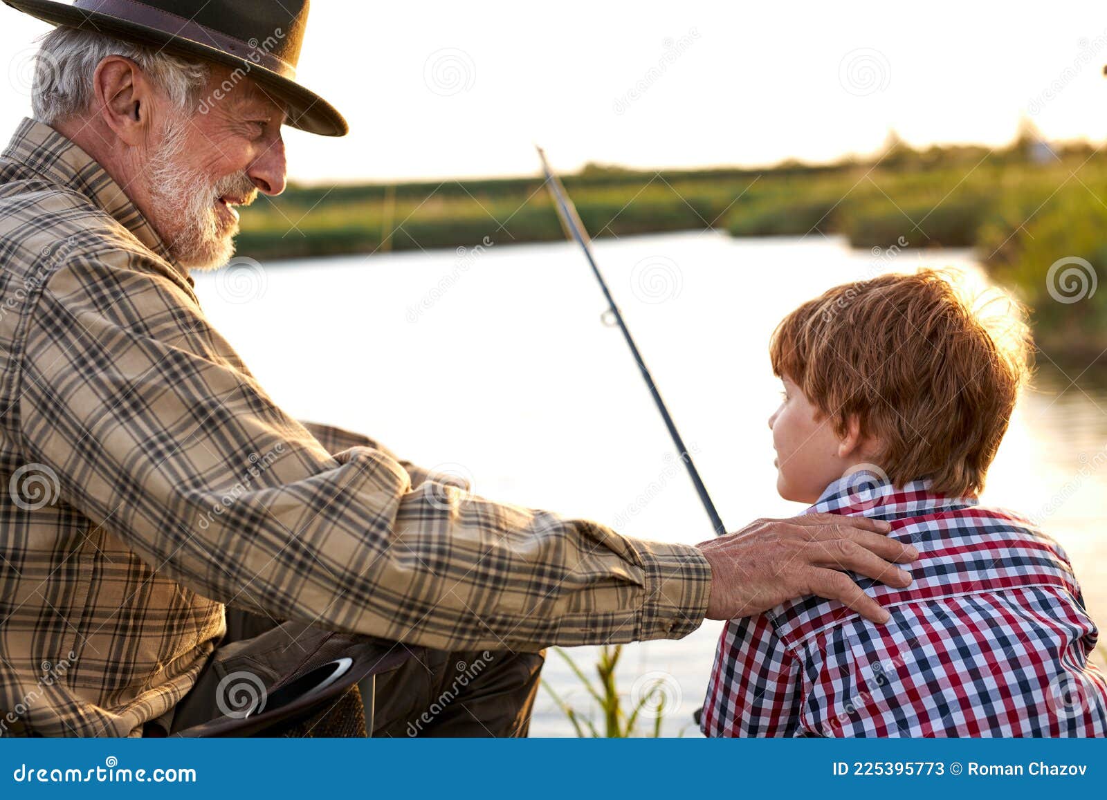 Back View Portrait of Adult Man and Teenage Boy Sitting Together on Lake  Fishing with Rods Stock Image - Image of person, leisure: 225395773