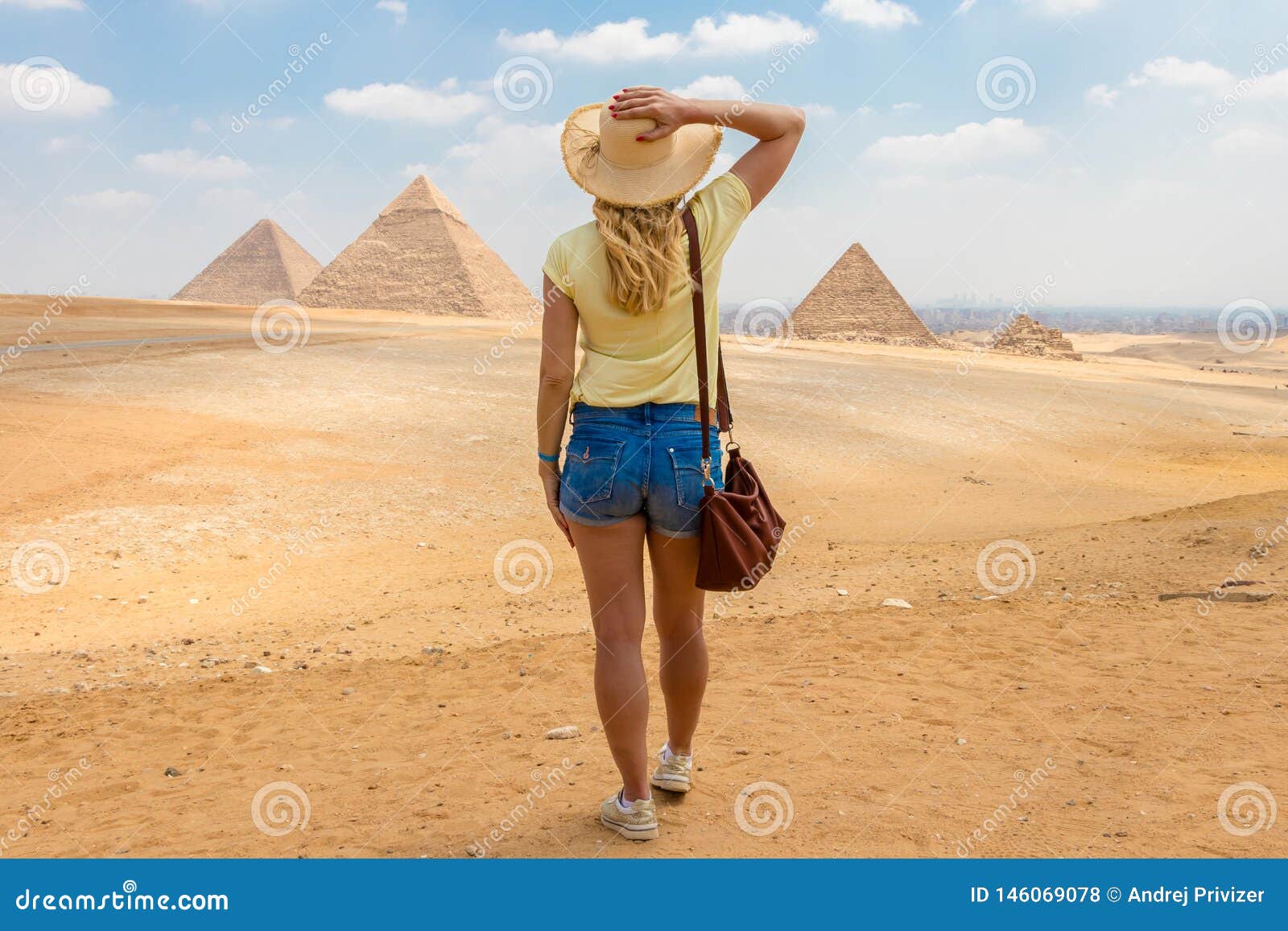 Back View Portrait Of A Single Woman Watching The Great Pyramids Of