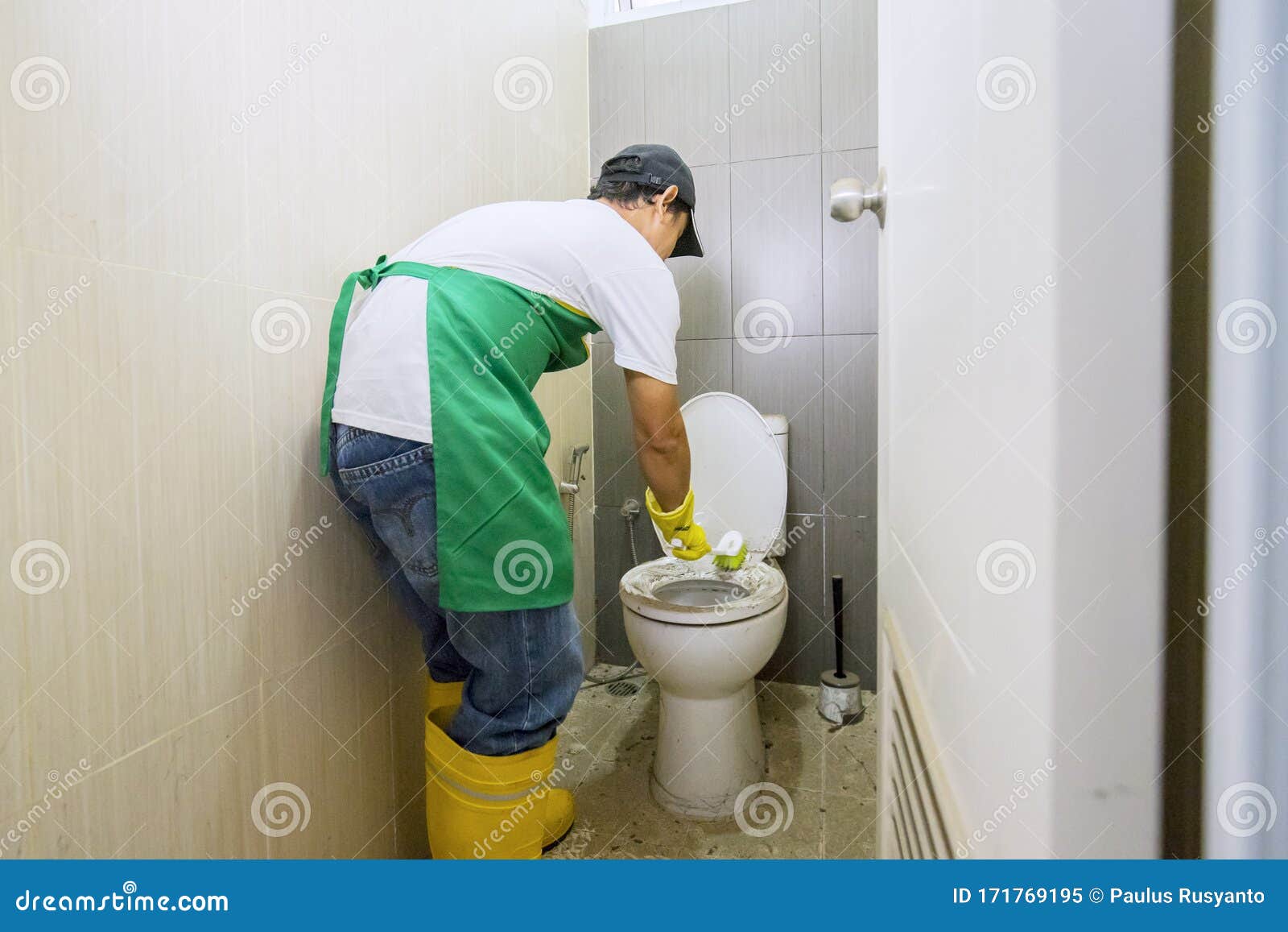 Attractive Housekeeping Cleaning Out A Toilet Stock Photo 