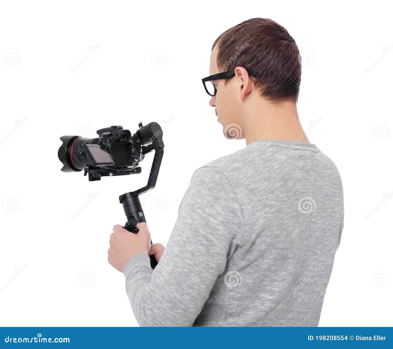 Back View of Professional Videographer Using Dslr Camera on Gimbal