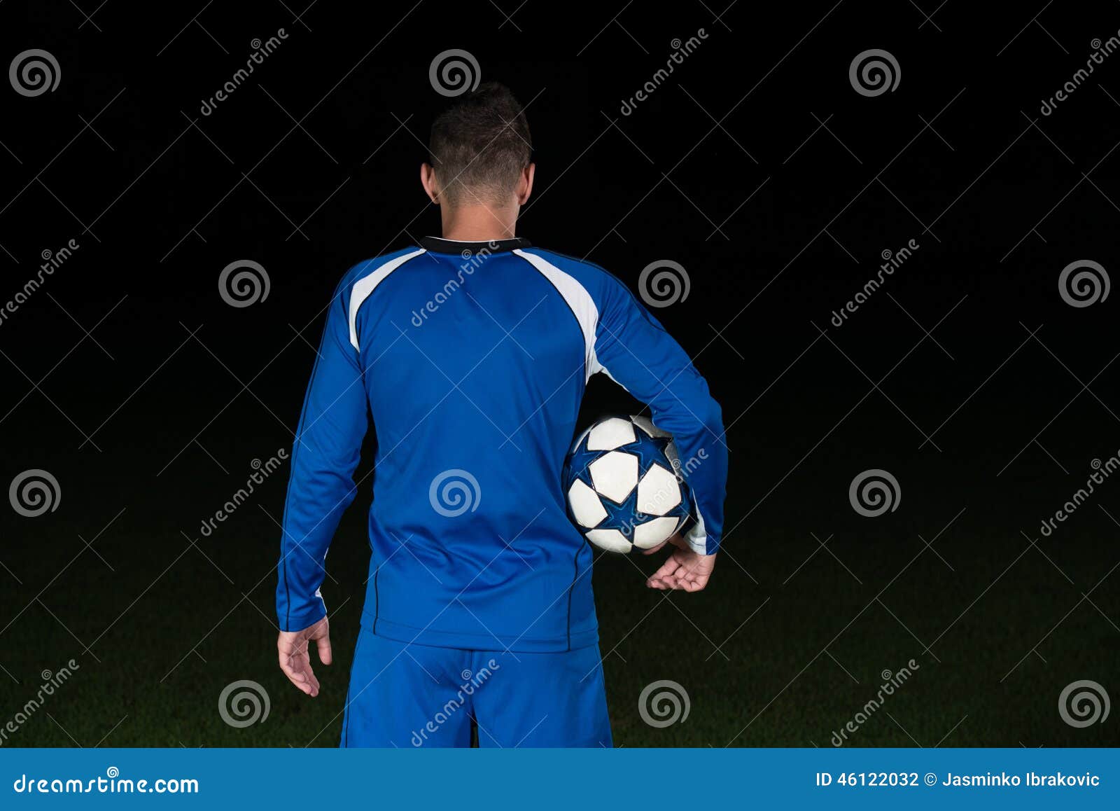 Download Back View Of Soccer Player On Black Background Stock Photo ...