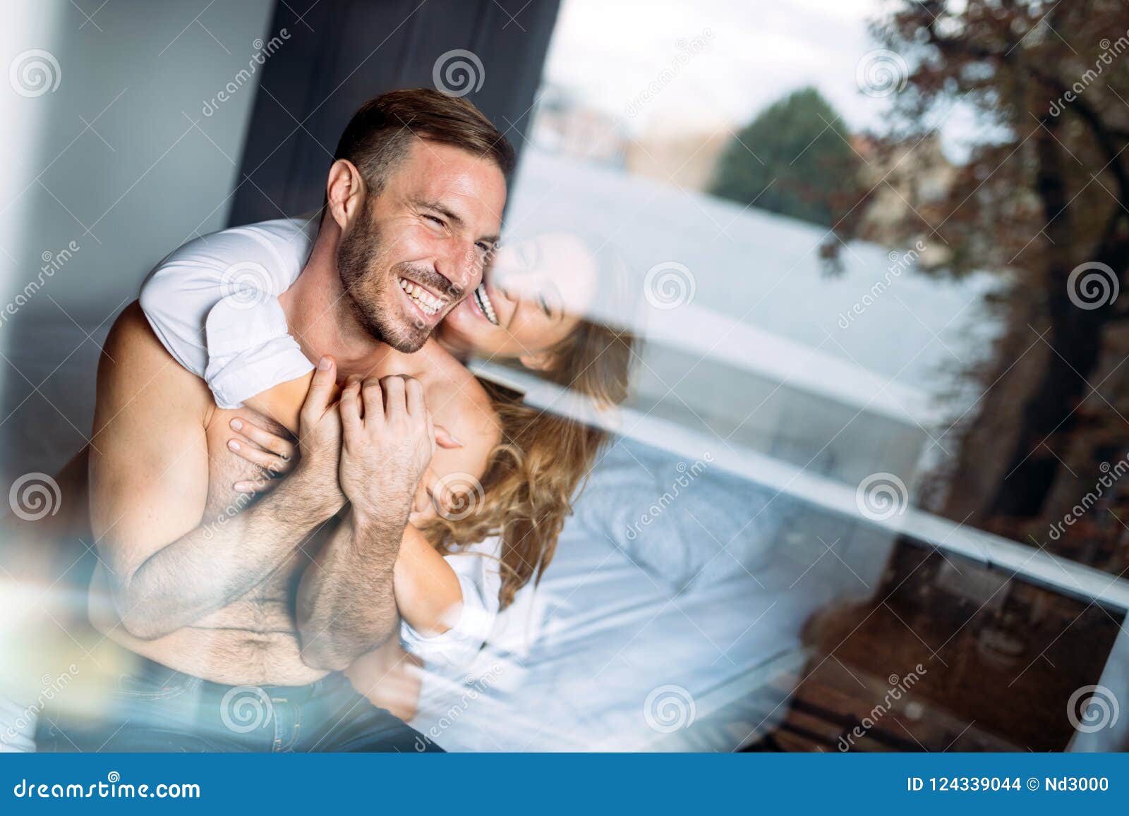 Couple Having Sex. Back View Of Woman In Black Panties Holding Her Bra  While Man Is Lying On Bed Stock Photo, Picture and Royalty Free Image.  Image 83690965.