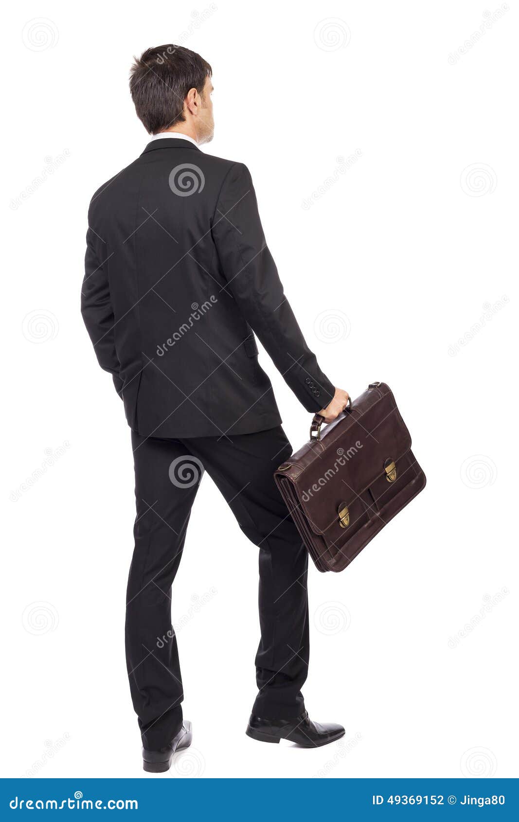 Back View of Young Businessman with Briefcase Walking Stock Photo