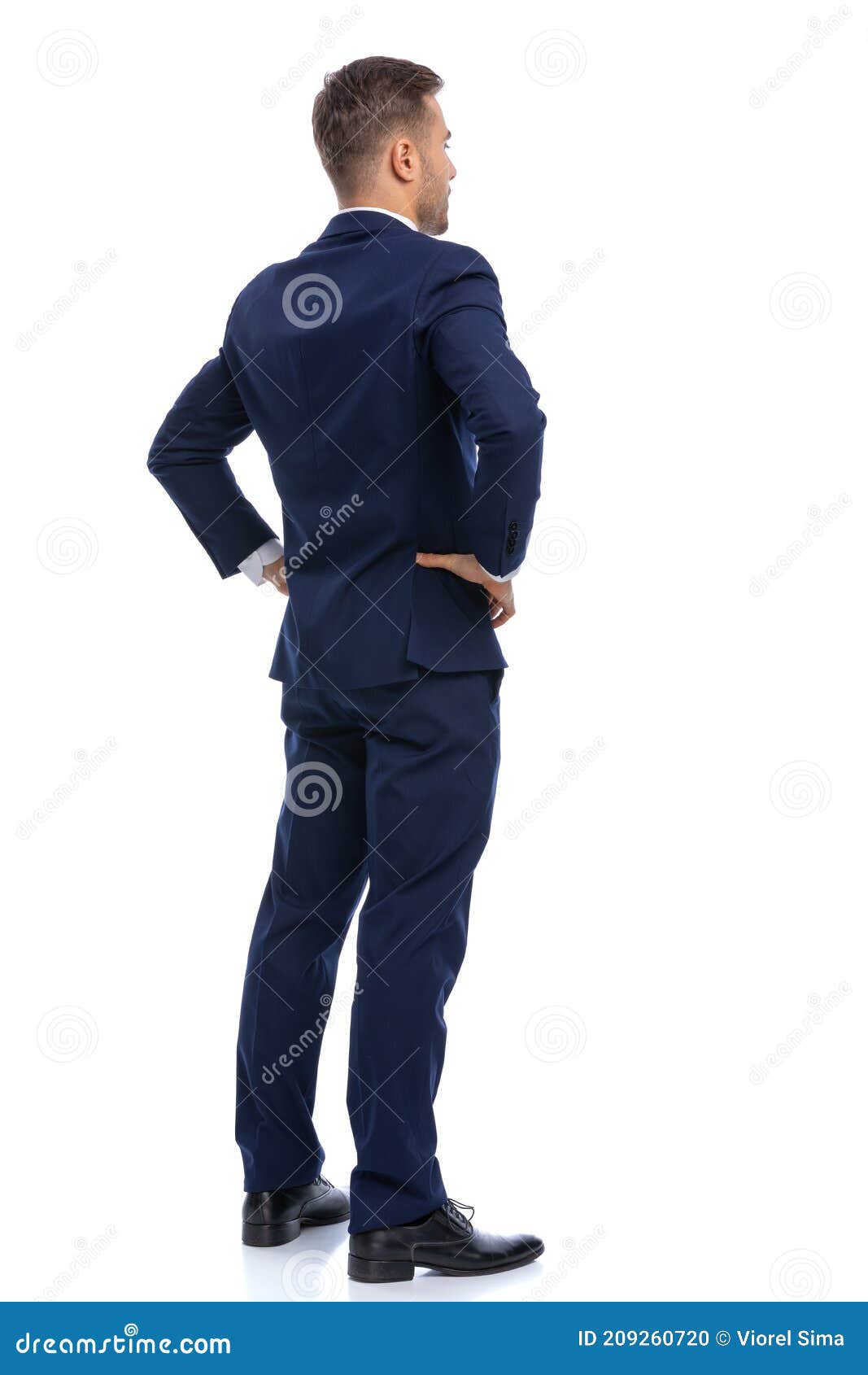 Back View of Young Businessman in Navy Blue Suit Holding Hands on Hips ...