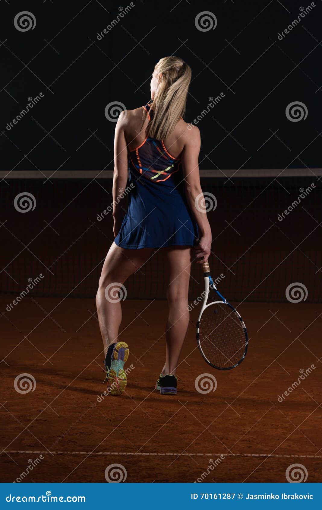 back view of young fit tennis player