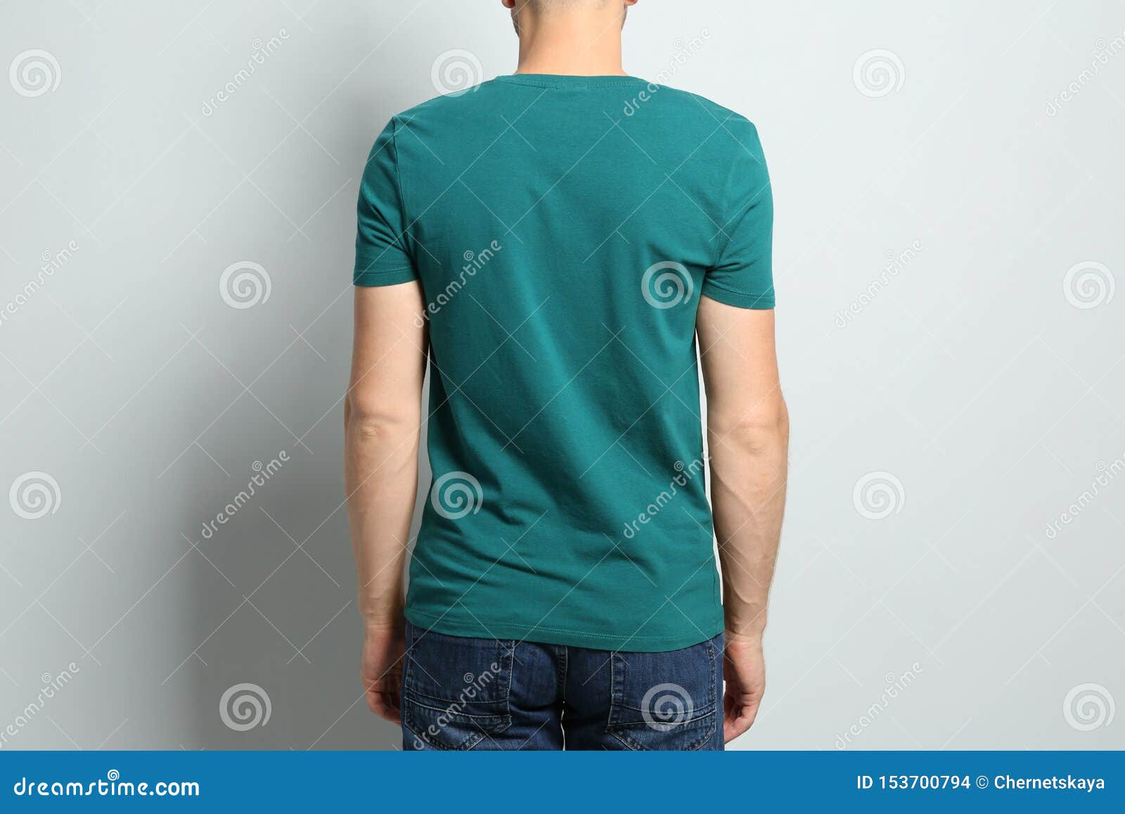 Back View of Young Man Wearing Blank T-shirt on Light Background ...