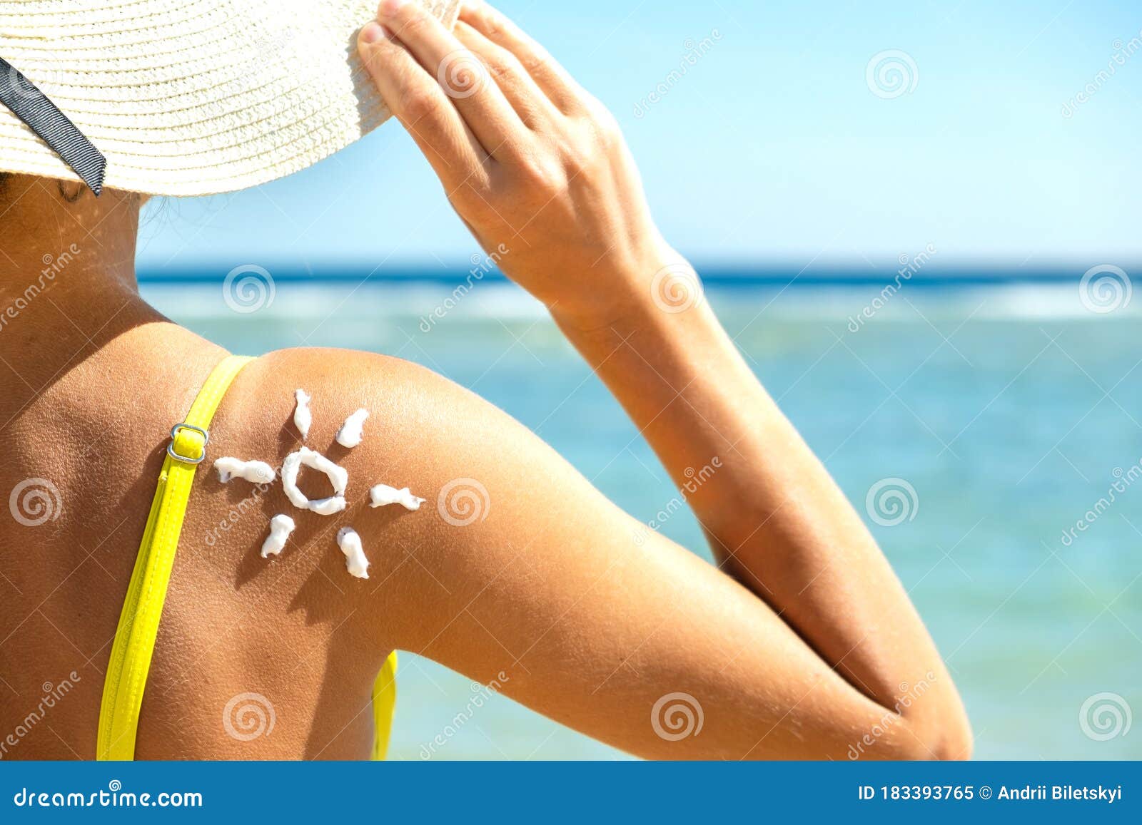 Back View of Young Woman Tanning at the Beach with Sunscreen Cream in Sun  Shape on Her Shoulder. UV Sunburn Protection and Stock Image - Image of  skincare, applying: 183393765