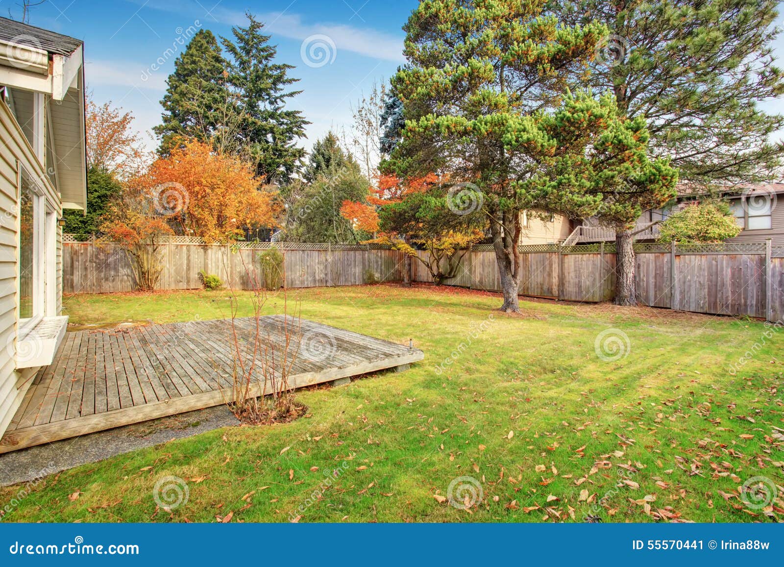 back yard with deck and grass.