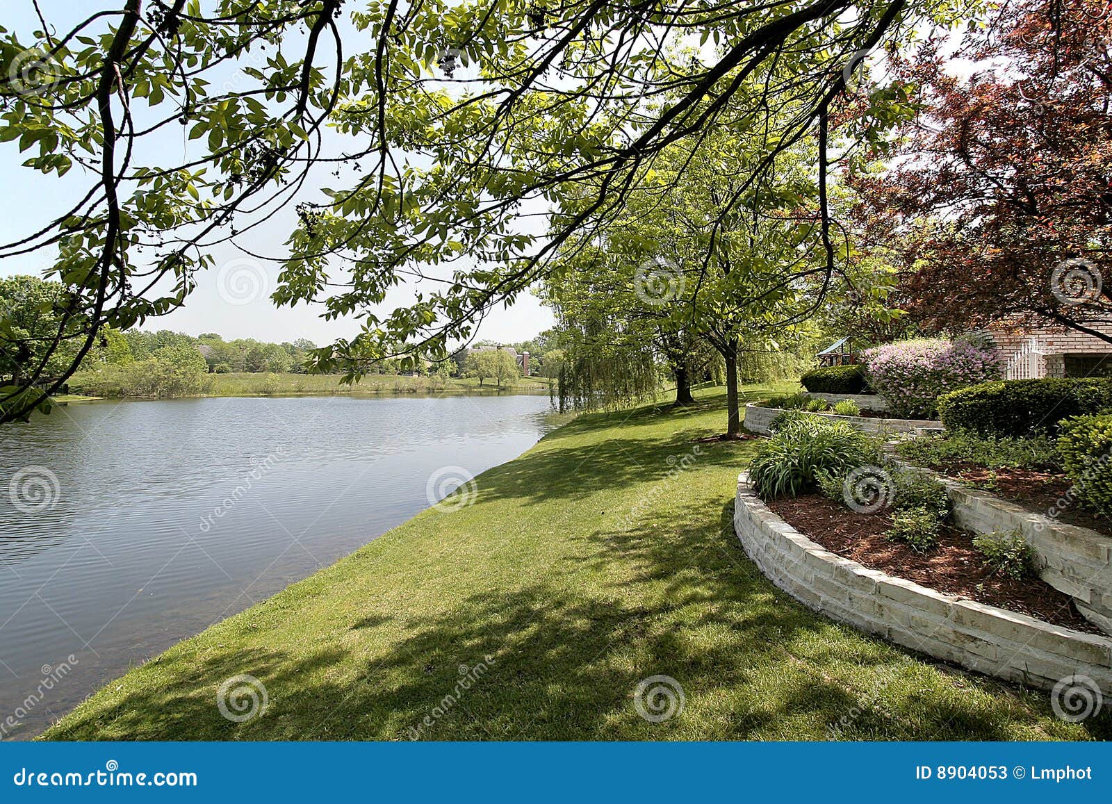 Back yard and lake stock image. Image of upscale, construction 8904053