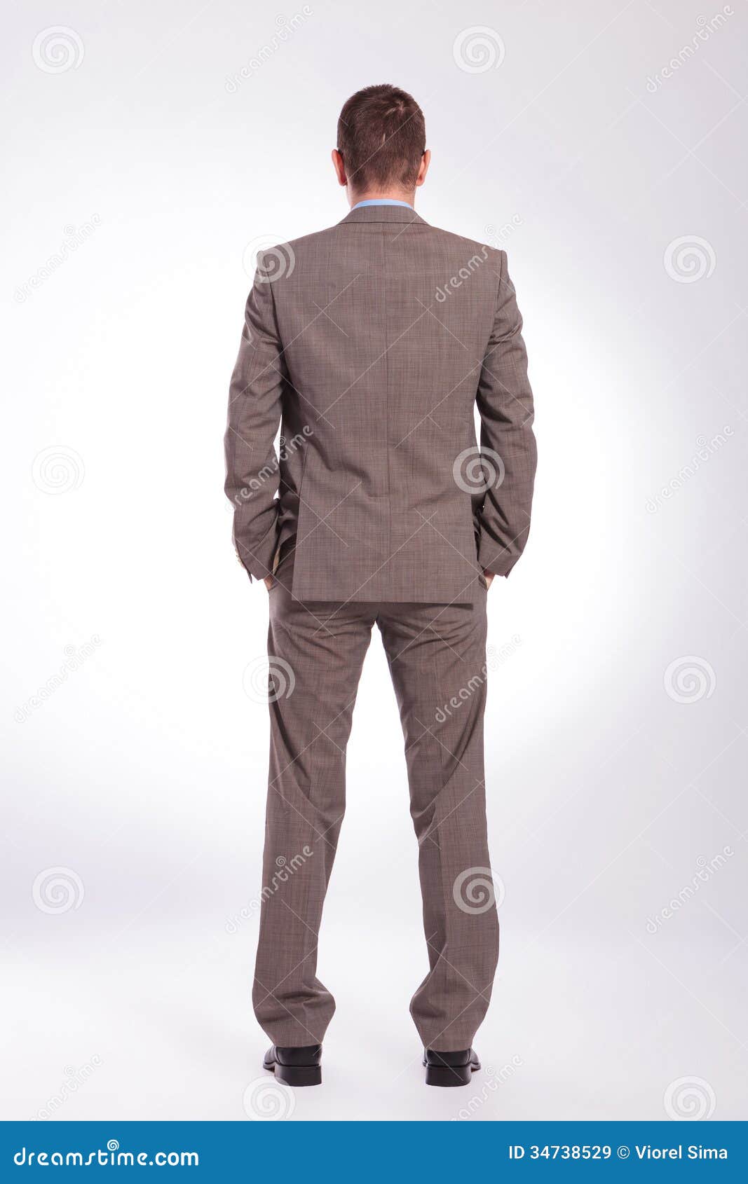 Back Of A Young Business Man With Both Hands In Pockets Stock Image ...