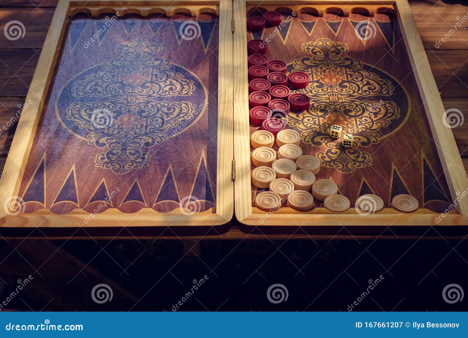 Backgammon Board Game for Two Players on a Special Board. Sun Rays