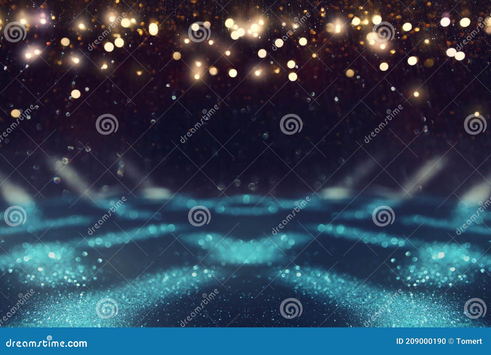 Background of Abstract Blue, Gold and Black Glitter Lights. Defocused