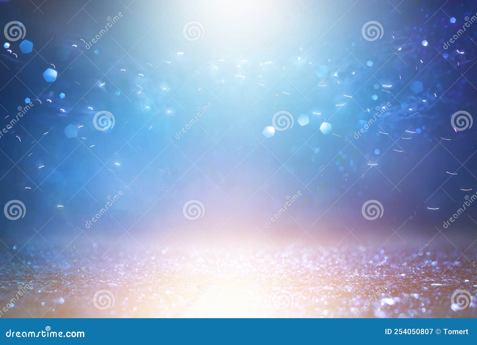 Background of Abstract Gold and Blue Glitter Lights. Defocused Stock