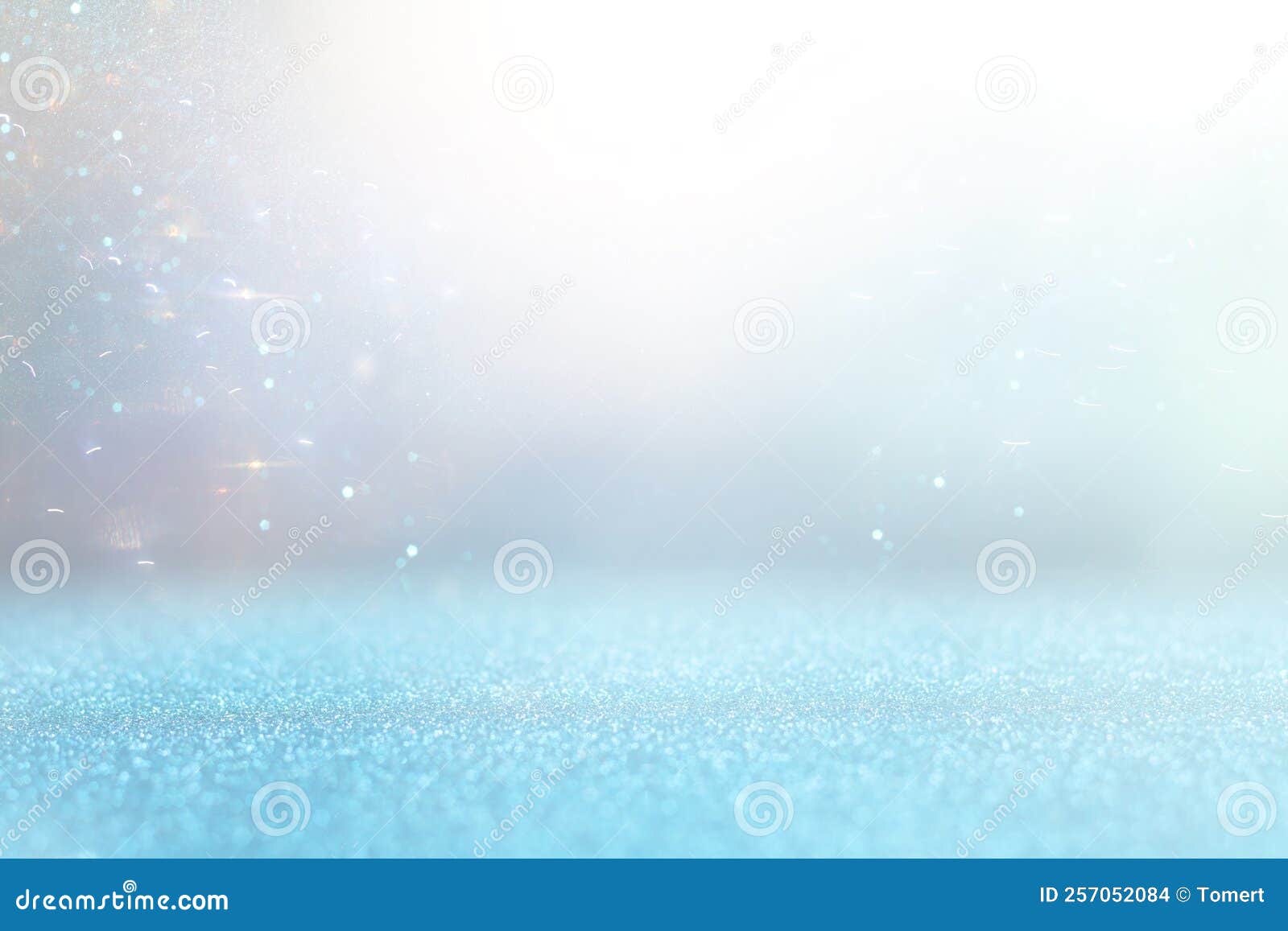 Background of Abstract Gold, Blue and Silver Glitter Lights. Defocused