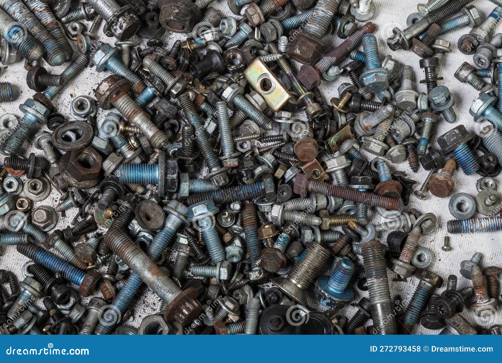 Background of Bolts and Nuts of Different Lengths and Threads. Industry