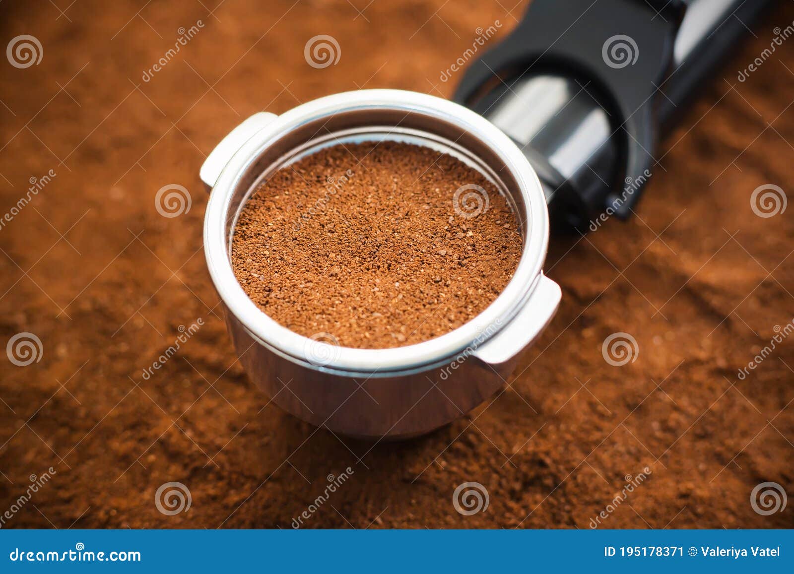 On the Background of Ground Coffee is a Holder from the Coffee Maker in