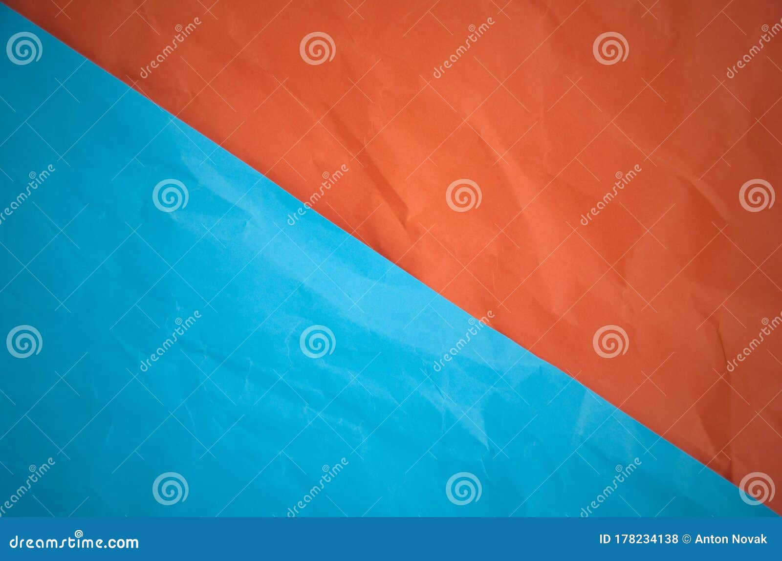 Background of Half Orange and Half Blue Paper Texture.Orange Blue Paper