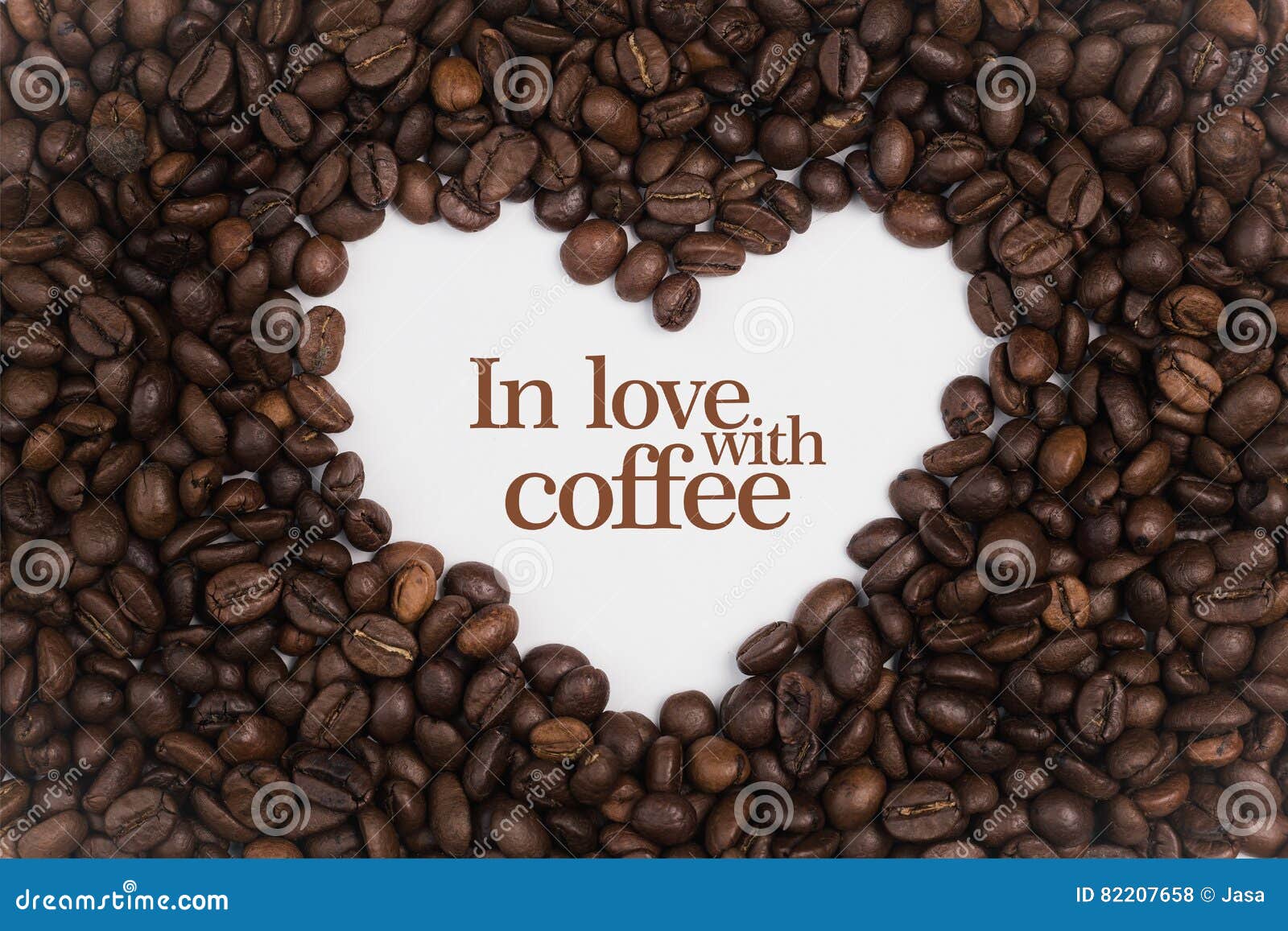 Background Made of Coffee Beans in a Heart Shape with Message `in Love
