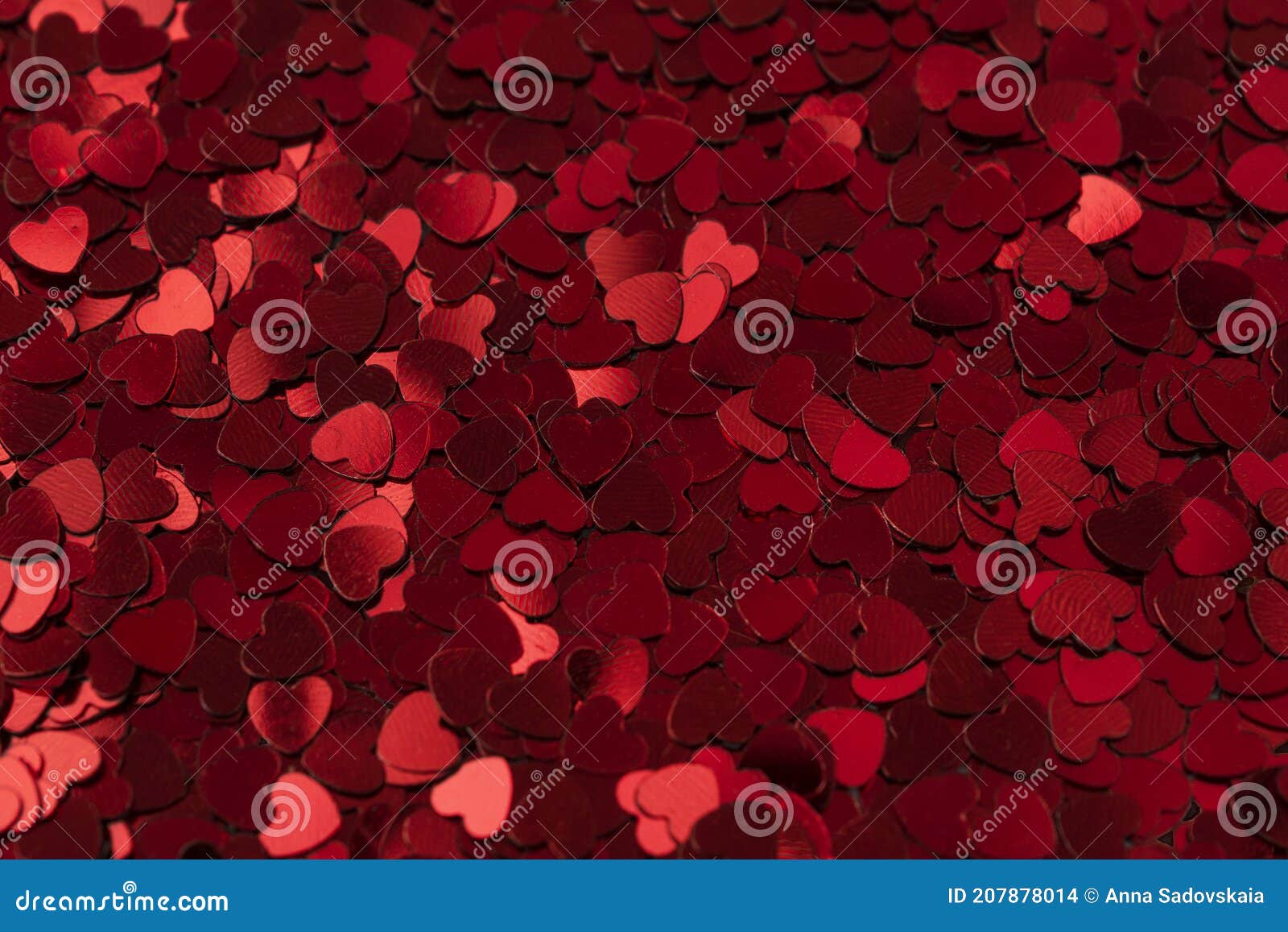 background made from little glittering heart confeti,